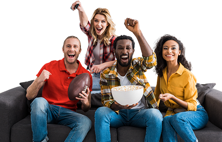 Group of people sitting on a couch with a football and popcorn